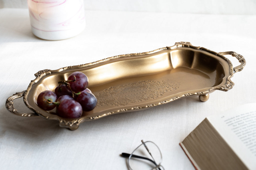 Classic brass serving tray with curved frame and cast handles