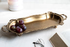 Classic brass serving tray with curved frame and cast handles