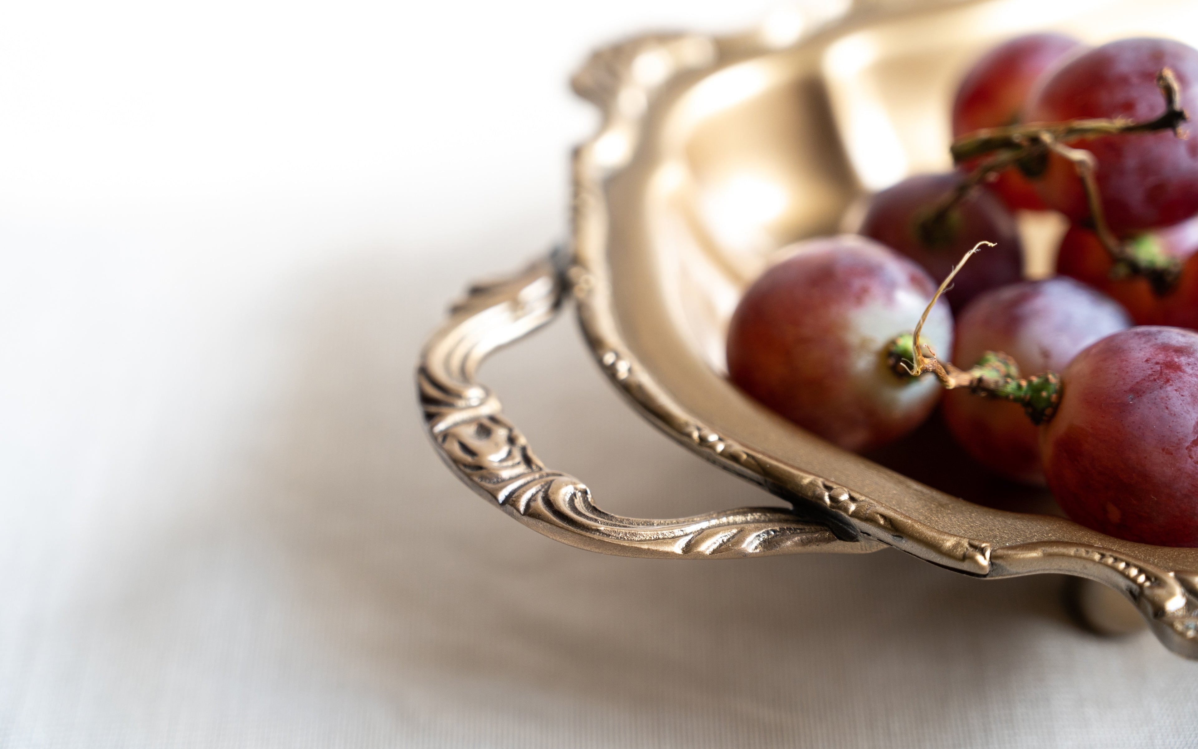 Close-up of antique brass handle tray
