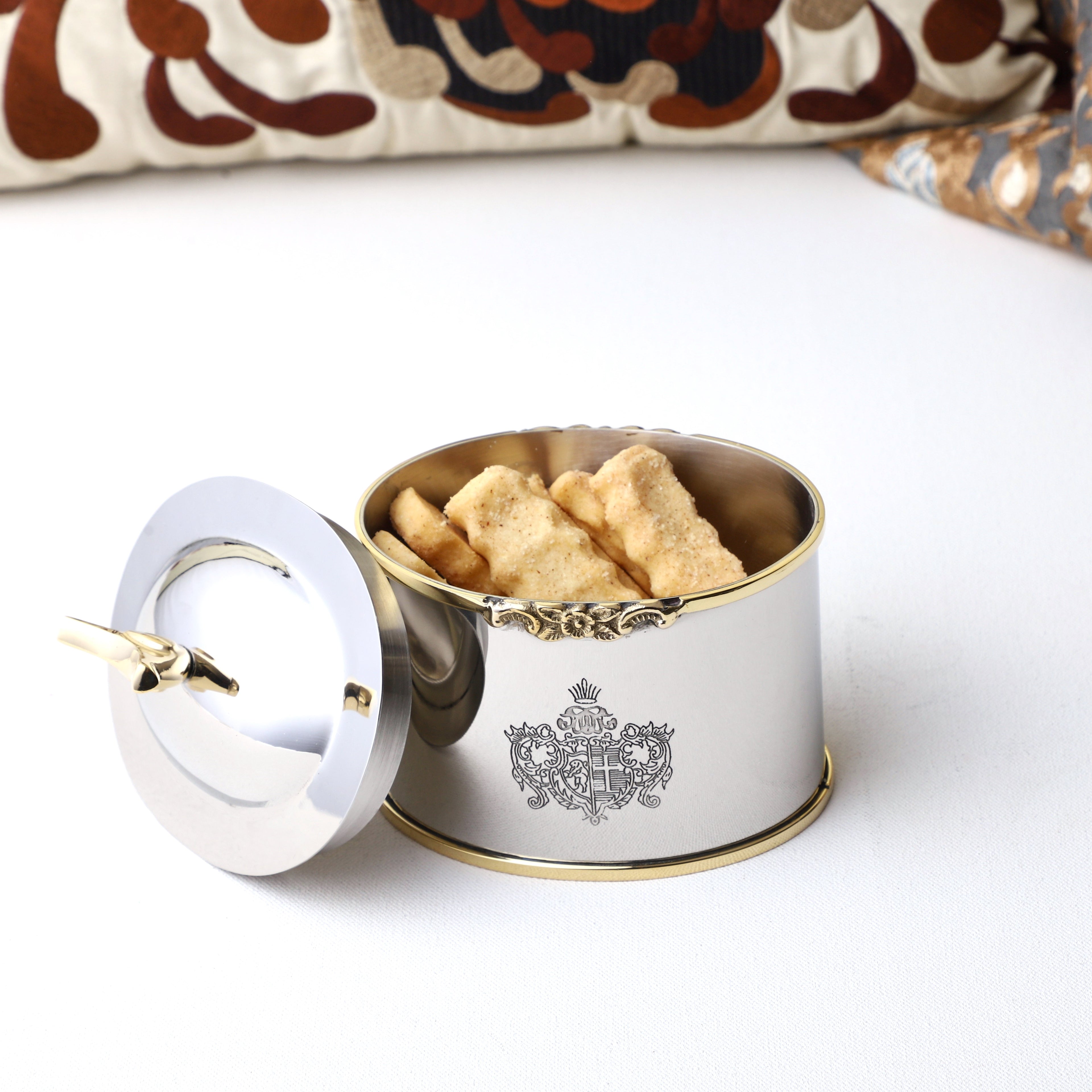 Silver toned container holding snacks